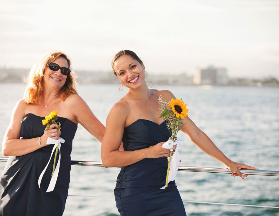 two ladies attending a wedding event on sailboat in san diego